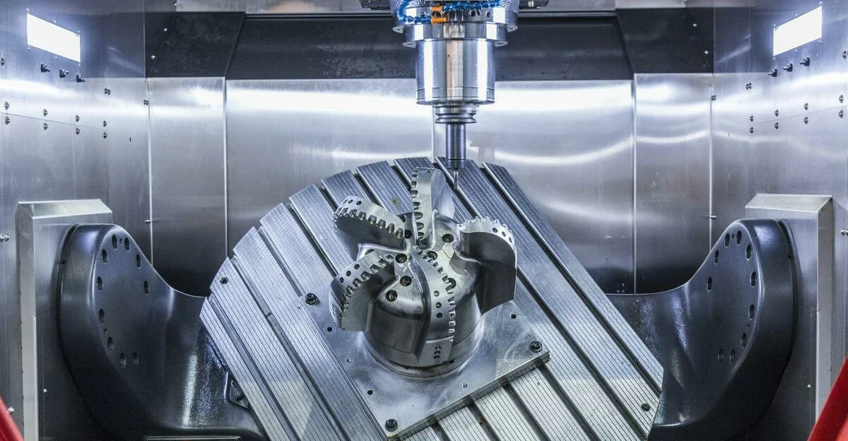 5-axis CNC vertical machining center processing precision impeller metal workpiece on rotary tilting table for complex industrial component custom machining