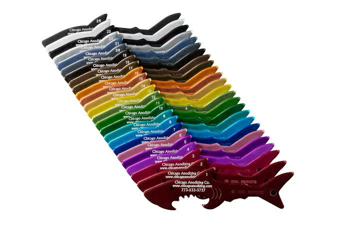 Variety of custom aluminum machined parts displaying multiple vibrant color options available with Type II anodizing.